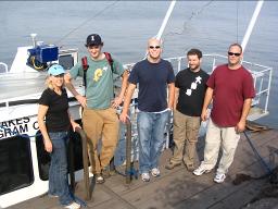 Keri Hornbuckle and other researchers pose by a boat