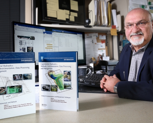 Marion Muste at his desk