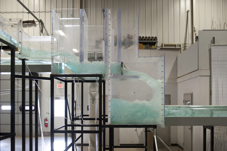 a side view of a portion of IIHR's London sewer model, with water flowing through