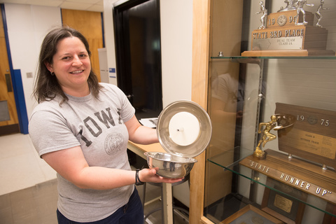 Rachel Marek holds a PCB collector