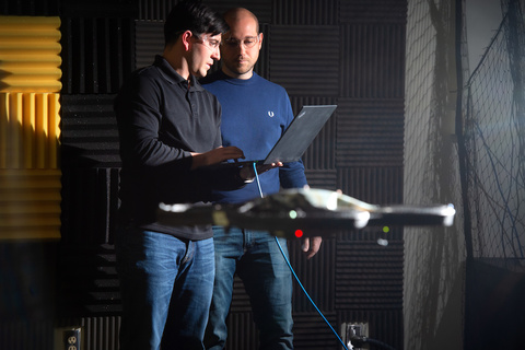 Venanzio Cichella works with a student in his lab
