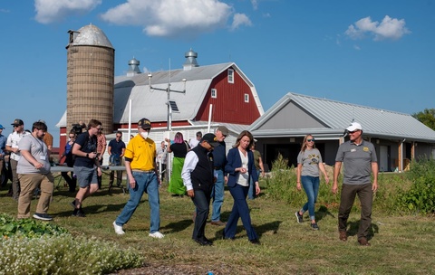 A group of people touring a farm