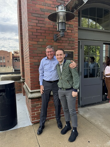 Two smiling men outside the entrance of Stanley Hydraulics Lab