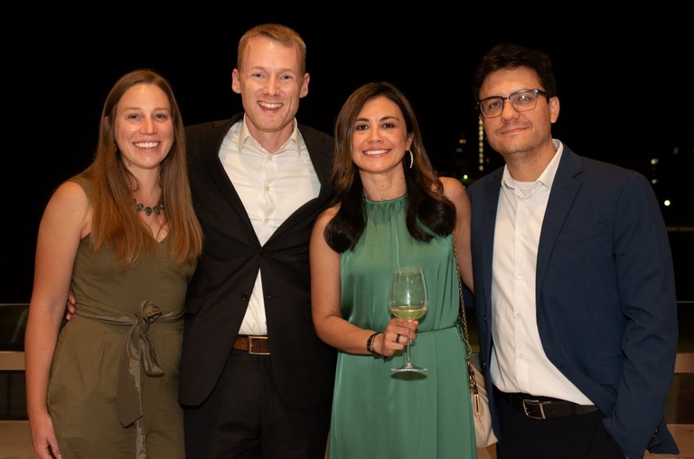 Four people pose for a photo
