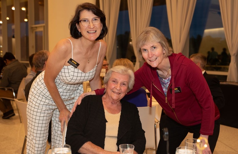 Three people pose for a photo