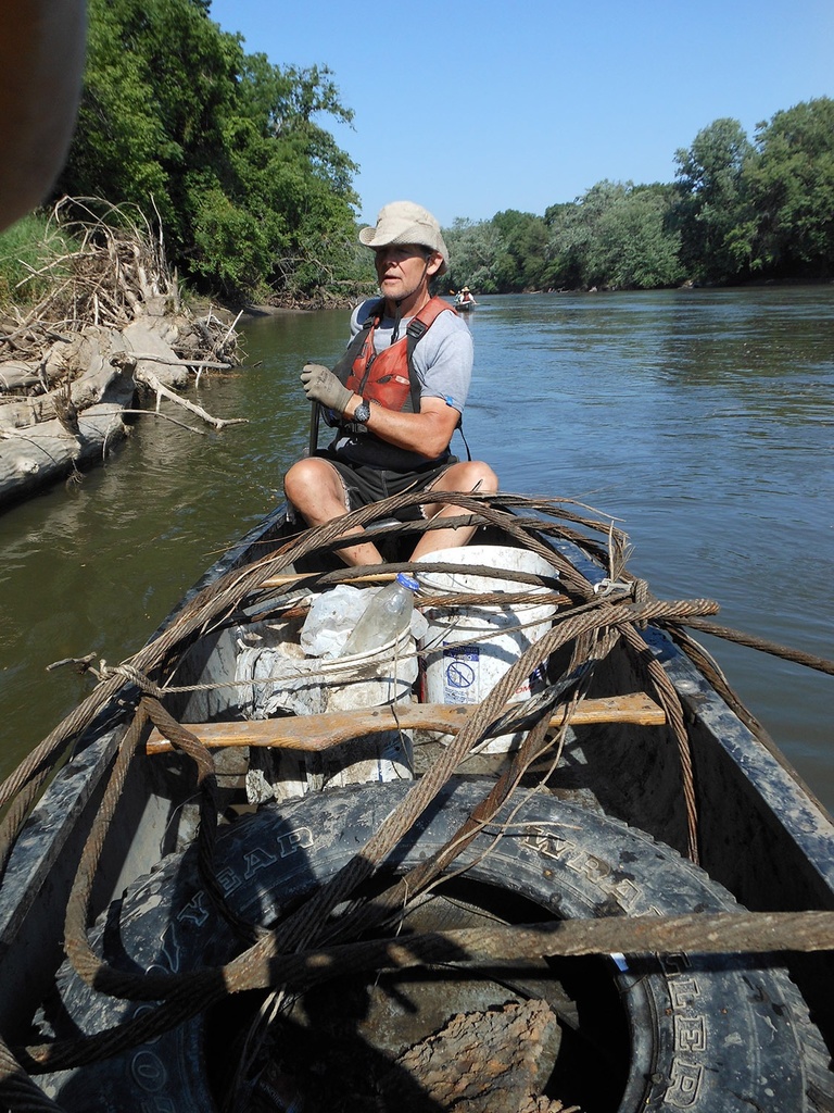 man in boat participating in project aware