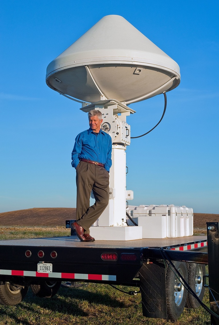 Witold Krajewski standing next to a radar instrument