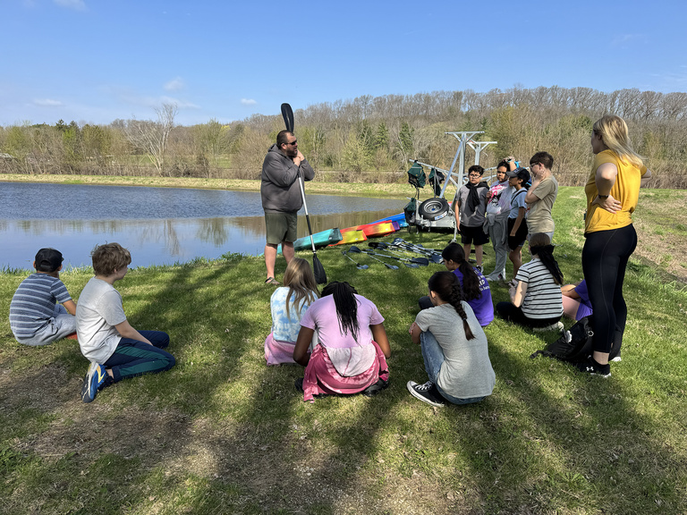 DNR staff teach the students how to kayak safely