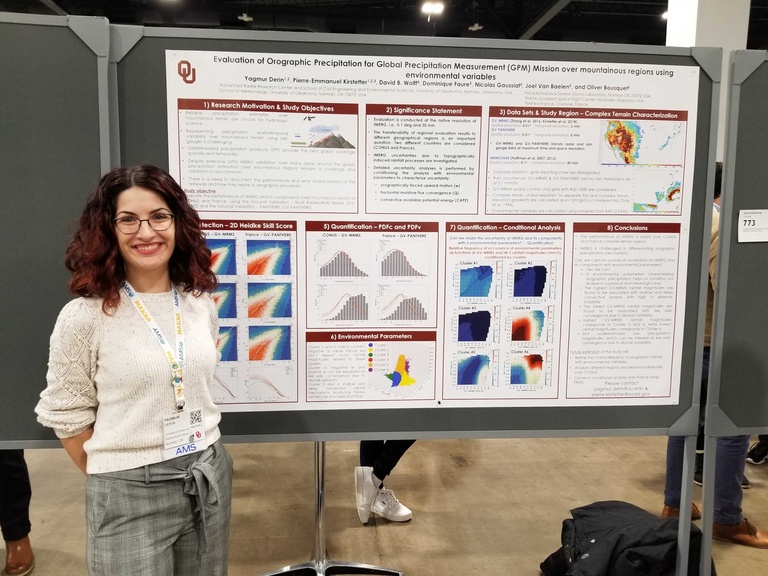 A smiling woman with a scientfic poster