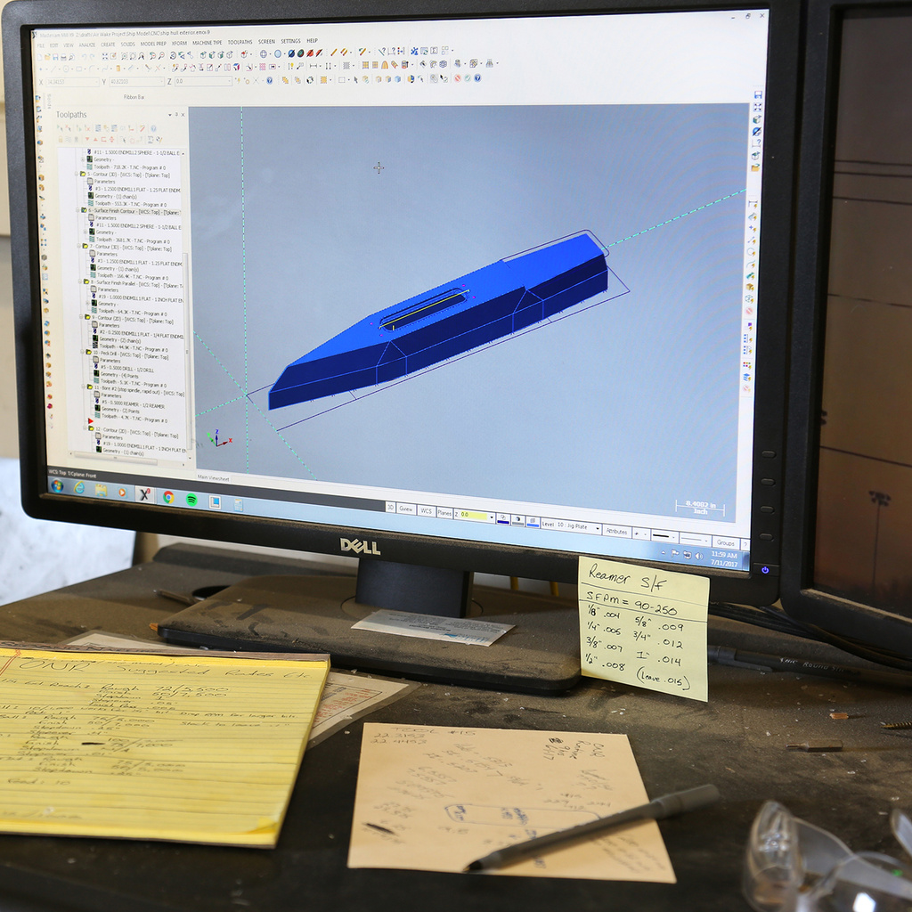 A computer shows a 3d model of a boat