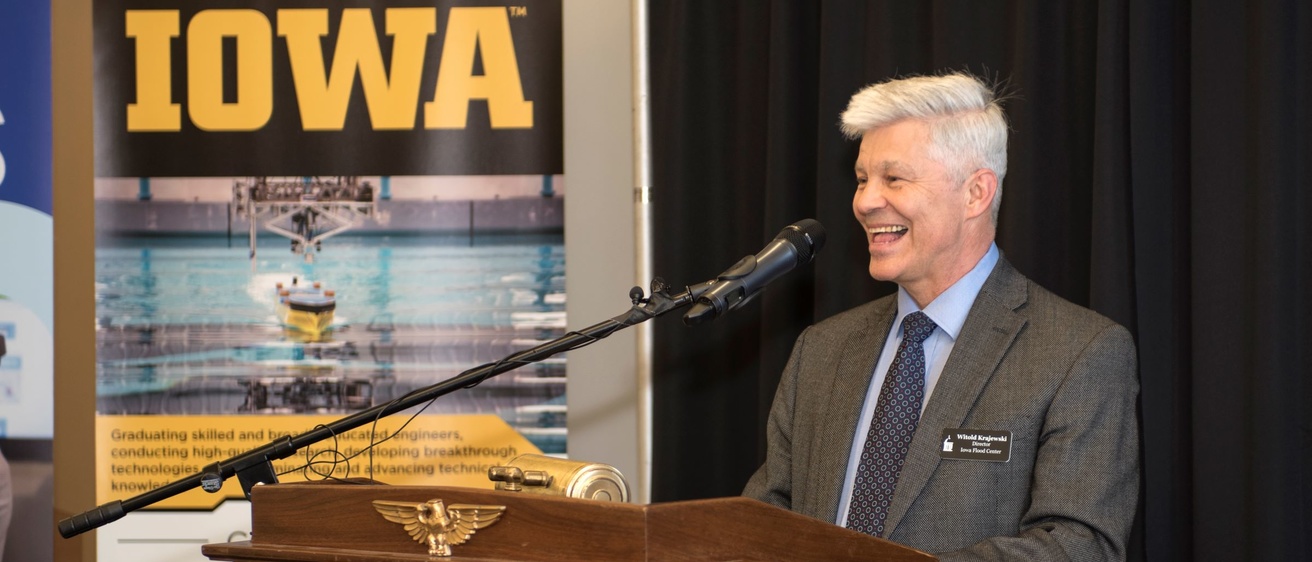 Witek Krajewski standing at a podium