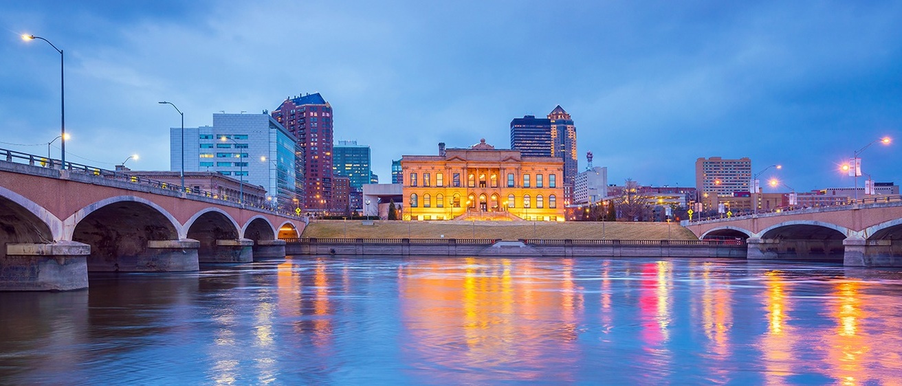 A shot of Cedar rapids at dusk, from the river, facing the downtown buildings