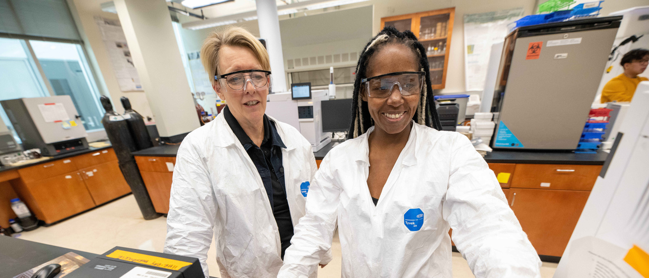Alexis Slade and Keri Hornbuckle in the lab researching PCBs and air quality
