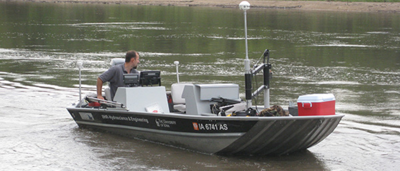 IIHR researcher on a boat