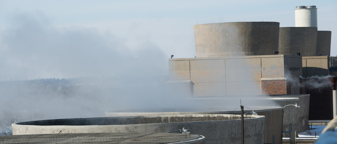 Steam billows from a power plant
