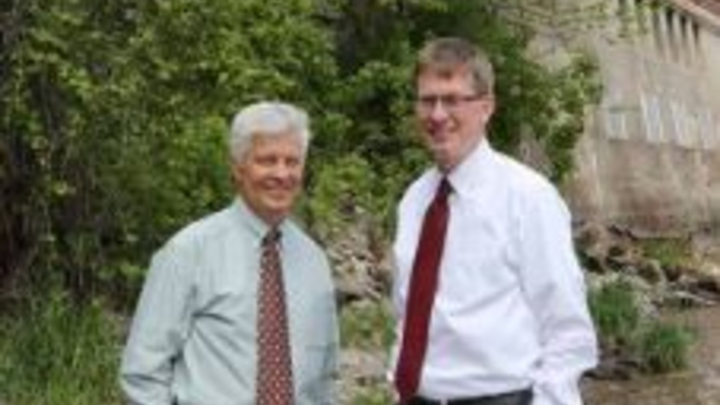 Witold Krajewski and Larry Weber pose near the Stanley Hydraulics Laboratory