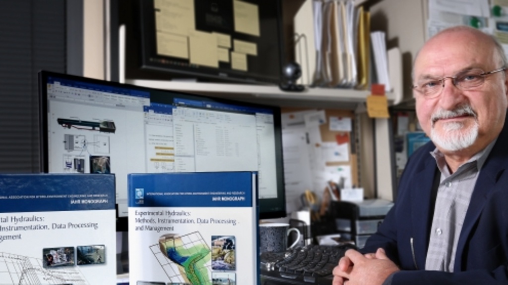 Marion Muste at his desk