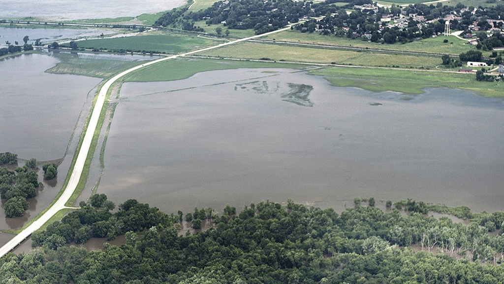 an aerial photo of a flooded small town