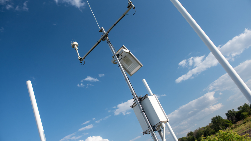 The view looking up at a hydrostation, against a blue clear sky